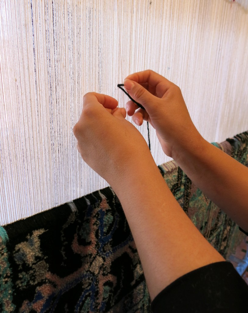 Rugmaker at Dar Zarbia co-op, Fes